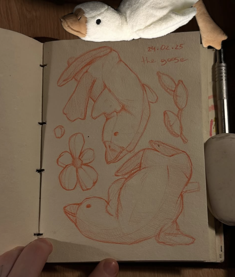 Original tattoo design — red sketch of dolphins and flowers in sketchbook — tattoo design Barcelona