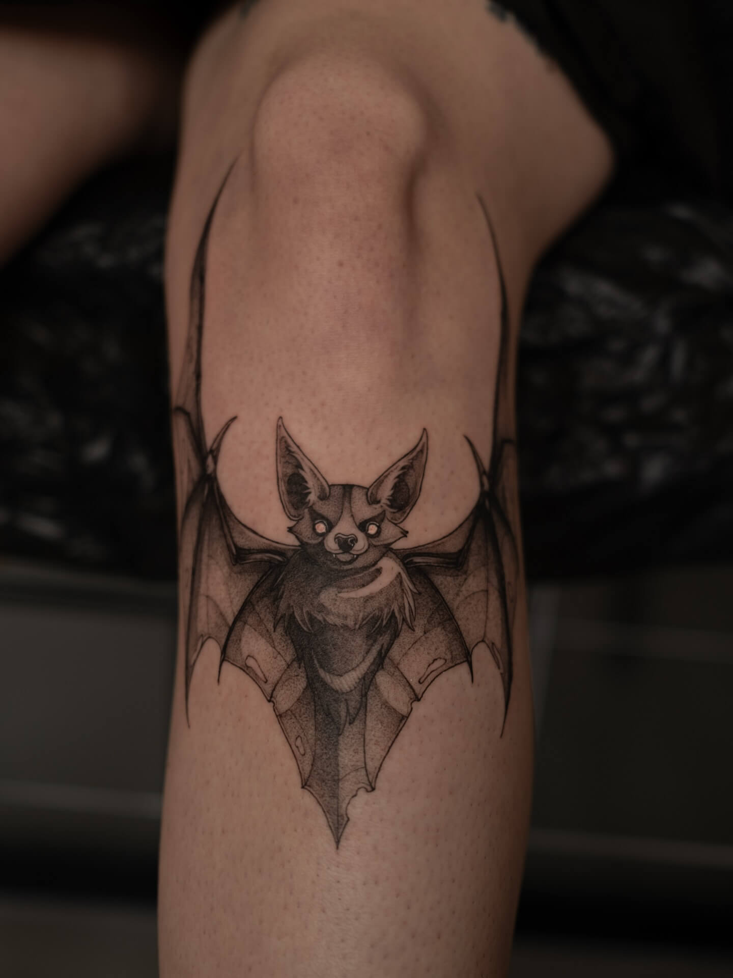 Graphic bat tattoo on knee — tattoo Barcelona